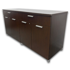 Used 96"W National Espresso Buffet Credenza Used National buffet credenza featuring an espresso laminate finish, four locking storage compartments, and two utility drawers. Provides organized storage for conference rooms, executive offices, and hospitality spaces at a fraction of the cost of new. Two utility drawers for supplies and accessories Four locking storage compartments Espresso laminate finish Brushed metal pulls Dimensions: 96" W × 23.8" D × 35" H Perfect for offices, executive suites, and collaborative workspaces.