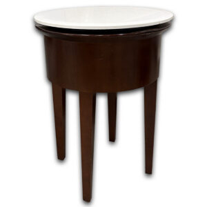 Used 18" Round End Table - White Top W/ Mahogany Legs  The Used 18" Round End Table provides a convenient surface for beverages, décor, reading materials, or personal items in reception areas, lounges, and offices. Its compact footprint and wood construction make it an excellent companion table for lounge seating and waiting spaces. Round tabletop with a rich wood finish Sturdy four-leg wood construction Compact size fits easily beside lounge chairs and sofas Dimensions: 24.3" W × 18" D This used end table could be commercial or residential. It is ideal for reception areas, executive offices, waiting rooms, lounges, living rooms, or any space that benefits from a compact accent table.