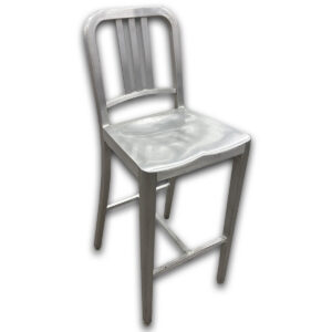Used Emeco Brushed Aluminum Barstool - 1006 Navy Stool Hand Brushed The Used Emeco 1006 Navy Bar Stool is an iconic commercial seating solution handcrafted from recycled aluminum. Originally designed for the U.S. Navy, this stool is renowned for its exceptional strength, lightweight construction, and timeless industrial design, making it ideal for demanding commercial environments. Authentic Emeco 1006 Navy Bar Stool handcrafted from recycled aluminum Lightweight yet exceptionally strong, corrosion-resistant construction Integrated footrests and contoured seat for lasting comfort Dimensions: 17" W × 19.5" D × 43" H Seat: 15.5" W × 15" D Seat Height: 30" Mainly for commercial use, this used Emeco Navy Bar Stool is ideal for cafés, restaurants, bars, employee breakrooms, collaborative spaces, and bar-height meeting tables. Its durable aluminum construction is built to withstand decades of daily use.