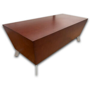Used 48"W Mahogany Rectangular Coffee Table Used rectangular coffee table featuring a rich woodgrain finish and contemporary geometric design. The enclosed base provides a clean appearance, making it a practical centerpiece for reception areas, lounges, and collaborative spaces. Rectangular tabletop surface Geometric enclosed base design Metal accent legs Commercial-grade construction Dimensions: 48" W × 21.8" D × 18" H Ideal for reception areas, lounge spaces, waiting rooms, and collaborative environments.