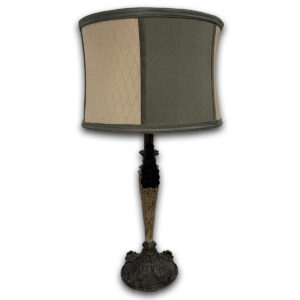 Used Gold/Green Table Lamp This used gold and green table lamp provides accent lighting for offices, reception areas, waiting rooms, or residential spaces. The decorative base and fabric shade make it well suited for desks, end tables, or credenzas where additional lighting is needed. Decorative metal base with gold and dark bronze finish Fabric drum shade in gold and green tones Standard table lamp design for task or accent lighting Dimensions: 13" Diameter × 29" H Could be used in commercial or residential spaces. Ideal for executive offices, reception areas, waiting rooms, living rooms, or bedside tables.
