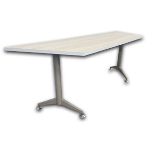 Used 77.5"W Trapezoid Training Table - Creme  Used trapezoid shaped training table with a cream laminate work surface and grey metal legs. The spacious top provides room for individual workstations, training sessions, collaborative meetings. Cream laminate work surface Grey metal T-leg base Leveling glides for floor adjustment Commercial-grade construction Dimensions: 77.5" W × 24" D × 29" H Ideal for training rooms, classrooms, meeting areas, and collaborative workspaces.