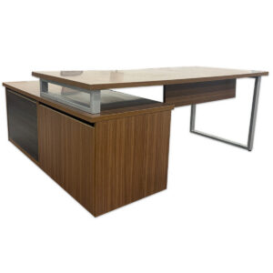 Used Modern Walnut Layered Lower Storage L-Shape Desk- RH The Used Modern Walnut Layered Lower Storage L-Shape Desk features a raised main worksurface paired with a lower right-hand storage return. The return provides open shelving and locking drawer storage for files and office supplies. Right-hand L-shape configuration Layered lower storage return with open shelving Locking drawer and file storage Dimensions: Desk: 144" W × 30" D × 29" H Return: 120" W × 24" D × 22.5" H Mainly for commercial use, including executive offices, private offices, and management workspaces.