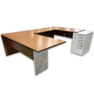 Used 71″ W Group Lacasse U-Shape Desk W/ Pedestal – Modern Walnut / White Spacious workstation designed to support a full executive setup with a continuous wraparound worksurface. This Group Lacasse U-shape configuration provides room for multiple monitors, paperwork, and daily workflow while keeping storage within reach. Right-hand U-shape configuration with desk, bridge, and credenza Modern walnut laminate with contrasting white support panel Includes (1) white box/file pedestal for secure storage Full modesty panels for a clean, professional presentation Integrated grommets for cable routing Dimensions: Desk: 71"W x 29.5"D x 29"H Bridge: 41.5"W x 24"D Credenza: 71"W x 29.5"D x 29"H Ideal for offices, executive suites, and collaborative workspaces.