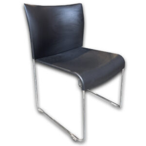 Used Keilhauer Sled-Base Stacking Chair - Black  Used Keilhauer stacking chair with a black molded seat and back supported by a chrome sled base. The lightweight design allows multiple chairs to stack together, making them a practical seating solution for meeting rooms, training areas, and multipurpose spaces. Stackable design for efficient storage Black molded seat and back Chrome sled base frame Dimensions: 19.5" W × 18.5" D × 30" H \ Seat: 17.5" W × 20" D × 14" H Ideal for conference rooms, training spaces, breakrooms, classrooms, and event seating.