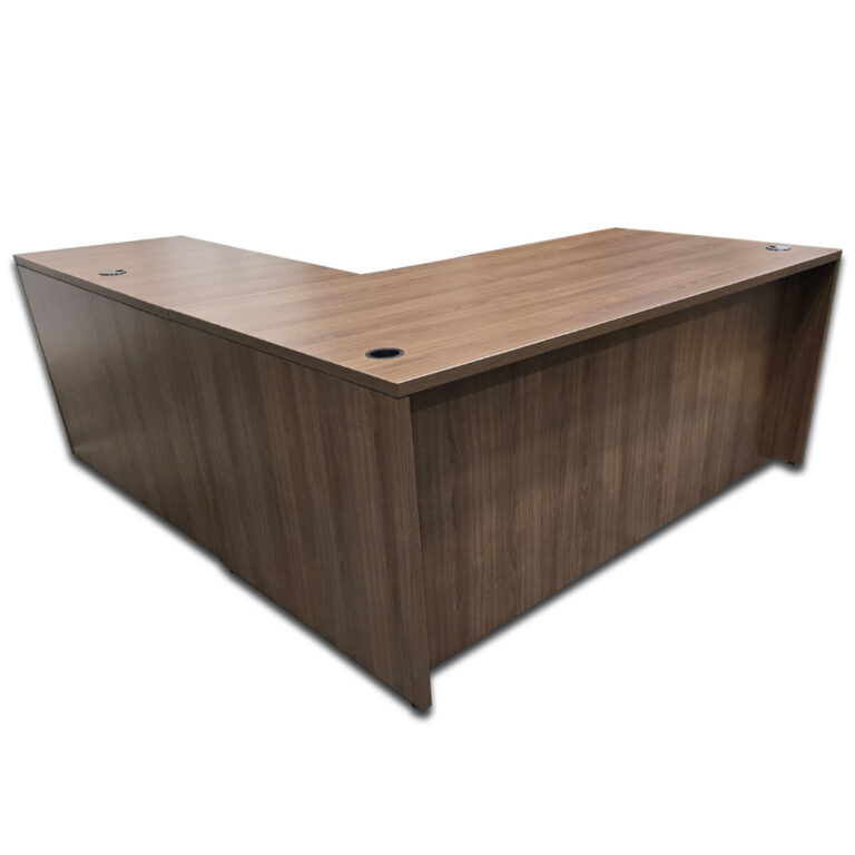 Used 71" W L-Shaped Desk In Walnut - Right Hand Return This L-shape workstation provides a practical layout with integrated storage and a generous surface area for daily tasks. Full workstation footprint with Right-hand return Two hanging box/file pedestals with locking drawers Walnut laminate surface Desk grommets for cable management Commercial construction suitable for office use Dimensions Main Desk: 71" W x 35.5" D x 29.5" H Return: 47" W x 23.5" D x 29.5" H Perfect for offices, executive suites, and collaborative workspaces.
