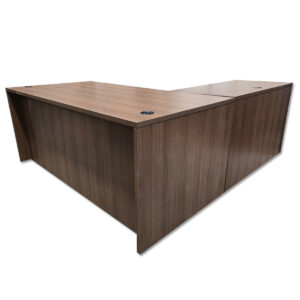 Used 71" W L-Shaped Desk In Walnut - Left Hand Return This L-shape workstation provides a practical layout with integrated storage and a generous surface area for daily tasks. Full workstation footprint with left-hand return Two hanging box/file pedestals with locking drawers Walnut laminate surface Desk grommets for cable management Commercial construction suitable for office use Dimensions Main Desk: 71" W x 35.5" D x 29.5" H Return: 47" W x 23.5" D x 29.5" H Perfect for offices, executive suites, and collaborative workspaces.