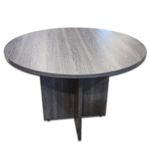 Used 42" Round Meeting Table - Grey Woodgrain This round laminate table offers a practical meeting surface with a clean, professional finish, perfect for collaborative office spaces or break areas. Durable laminate surface with woodgrain texture Sturdy panel base for stability Easy-to-clean and scratch-resistant finish Compact size ideal for small meeting areas or lounges Dimensions: 42" Diameter x 30"H Perfect for conference rooms, break areas, or small group collaboration settings.
