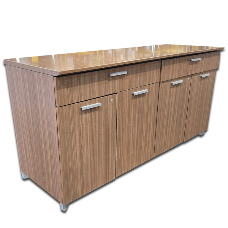 Used 72" W Buffet Credenza - Light Walnut  This sleek light walnut credenza offers generous storage and a refined look suited for professional spaces. Two drawers and four locking cabinet doors for organized storage Silver bar pulls for a clean, modern appearance Durable laminate top for easy maintenance Sturdy construction ideal for everyday office use Dimensions: 72"W x 25"D x 34"H Perfect for executive offices, conference rooms, and shared workspaces.