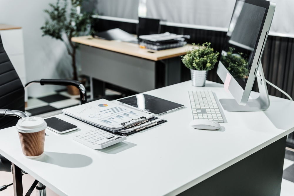 A,Modern,,White colored,Business,Office,With,A,Wooden,Desk,,Calculator,