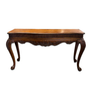 Used 61" W Hekman Furniture Inc. Brown Carved Wood Console Table This elegant console table by Hekman Furniture features a rich brown wood finish with detailed carved accents and curved cabriole legs. Its craftsmanship makes it a statement piece suitable for both traditional and formal environments. Brown wood construction Decorative carved detailing Cabriole-style legs Dimensions: 61"W x 21"D x 32"H Perfect for entryways, reception areas, and executive offices.