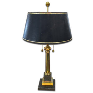 Used 29" H Black & Gold Table Lamp This elegant lamp features a gold column base with a square black marble platform and a black shade trimmed in gold. Dual pull chains offer easy operation, adding a refined touch to desks or side tables. Gold column base with marble-style footing Black shade with gold trim Dual pull chain switches Dimensions: 16"W x 16"D x 29"H Perfect for executive offices, reception areas, or traditional interiors.