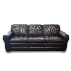 Used Brown Three-Seat Sofa - 92"W x 38"D x 36"H Spacious and practical three-seat sofa upholstered in brown vinyl, built for comfort and easy maintenance in busy environments. Brown vinyl upholstery for low-maintenance care Wide three-seat layout with supportive cushions Clean, boxy silhouette with a sturdy frame Dimensions: 92"W x 38"D x 36"H Perfect for office lounges, reception areas, or break rooms.