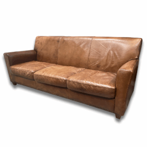 Used 82" W Three-Seat Distressed Leather Couch in Whisky Fabric Comfortable and stylish, this three-seat couch features distressed whisky-toned leather for a warm, lived-in look. Generously sized with a supportive frame, it's a great addition to any lounge or office waiting area. Three-seat configuration Distressed leather in whisky color Supportive cushions with classic styling Dimensions: 82"W x 32"D x 34"H Ideal for reception areas, executive lounges, or collaborative break spaces.
