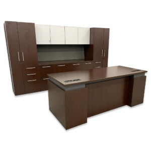 Used National Executive Height Adjustable Desk & Double Door Credenza Set  This executive workstation set combines an espresso-laminated height-adjustable desk with a full storage system designed for high-performance offices. The desk includes built-in desktop power for 12V and USB, while the wall-mounted credenza set delivers file, cabinet, and wardrobe storage to keep everything organized and within reach. Executive sit-stand desk Integrated desktop power (2 standard outlets & 2 USB) Lower File/File pedestal included Wall-mounted white glass cabinet Credenza with (2) file/file storage & two door cabinet  Two combination storage wardrobes Grey upholstered tack board Dimensions: Desk: 72"W x 30"D, adjustable height Credenza Set Overall: 114"W x 24"D x 67"H Credenza: 66"W x 23"D x 29"H Overhead Cabinet: 66"W x 16"D Wardrobe: 24"W x 24"D x 67"H Ideal for executive offices that demand a modern, organized, and adaptable workspace.