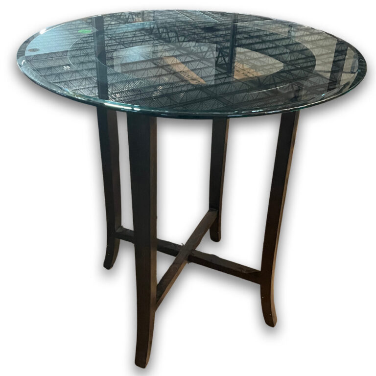 Used 42" Glass Top Round Bistro Table W/ Espresso Base A stylish round bistro table designed for lounge, café, or break areas, featuring a clear glass top and espresso-finished wood base for a modern, professional look. 42″ round clear glass top Espresso Finished wood base 42″ bar-height design Sturdy construction suitable for commercial use Dimensions: 42″Diameter x 42″H