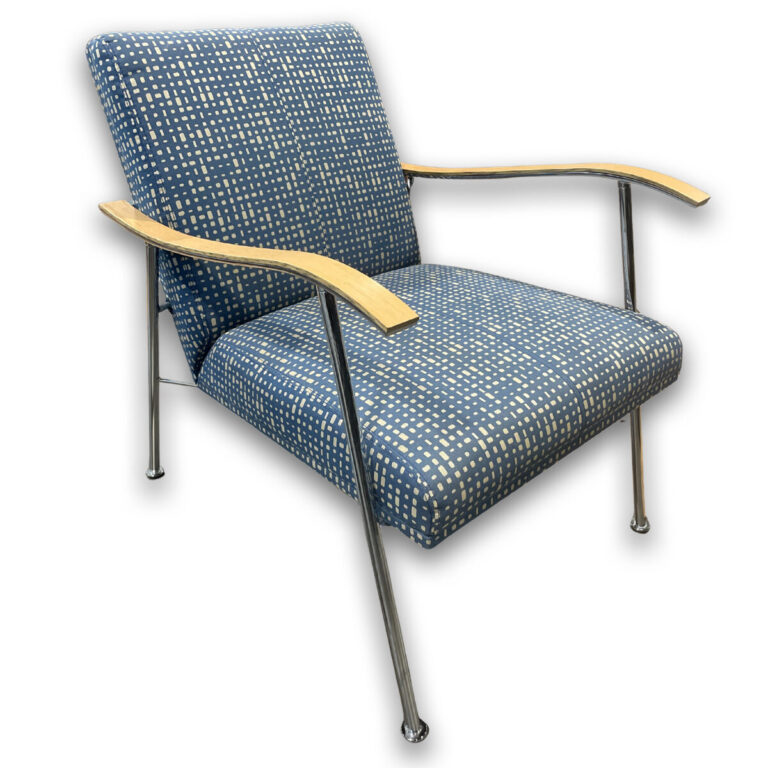 Used Blue Pattern Lounge Chair W/ Wood Arms and Chrome Frame A comfortable upholstered lounge chair designed for reception or guest seating areas, featuring blue patterned fabric with wood arms and a chrome frame for added support. Blue patterned upholstered seat and back Wood armrests Chrome frame and legs Supportive cushioned seating Dimensions: 23″W x 30″D x 30″H Perfect for reception areas, lounge spaces, and guest seating.