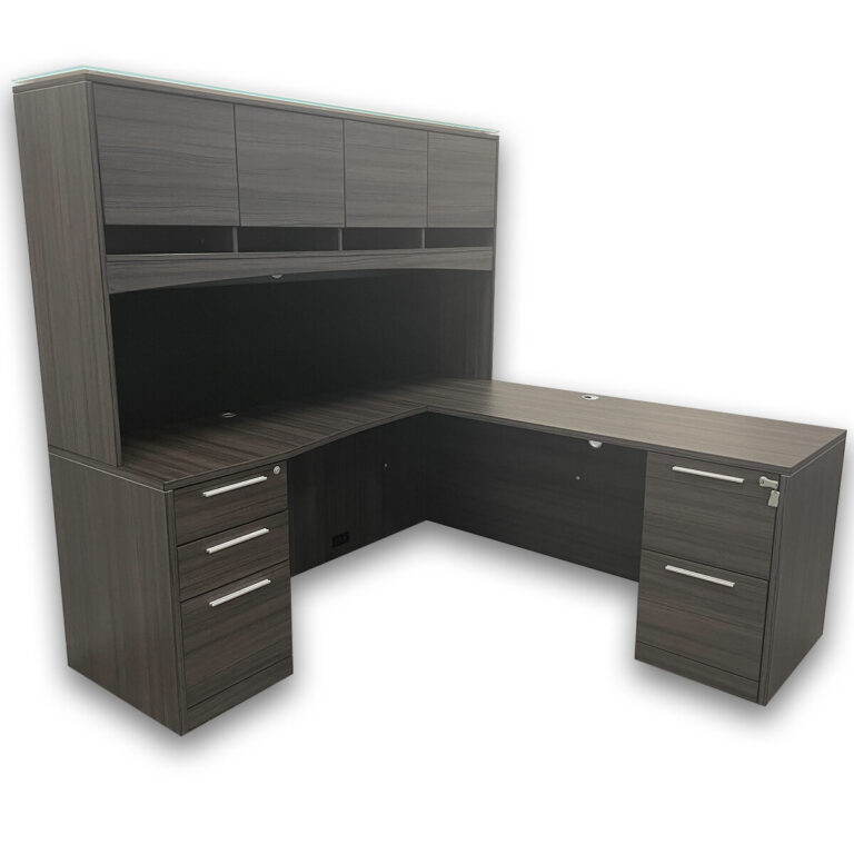 Used 72" W CorpDesign L-Shape Desk With Hutch In Grey This 72" W L-shape desk provides a functional workspace design and an overhead hutch for added storage. Finished in a grey wood-grain laminate, it combines surface space and organization for professional office environments. Grey Wood-Grain Laminate Finish Box, Box, File Pedestal & File, File Pedestal Soft Close Drawers Standard Overhead Hutch for Storage Functional L-Shape Configuration Dimensions: Desk: 72"W x 36"D x 30"H Return: 42"W x 24"D x 30"H Ideal for private offices, executive spaces, and collaborative work areas.
