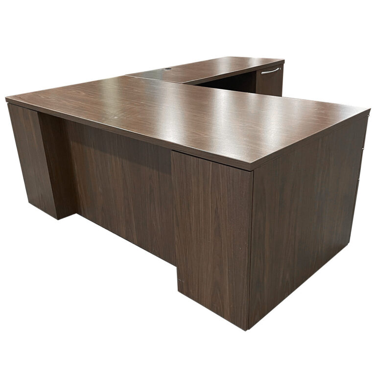 Used 72" W Kimball L-Shape Desk In Modern Walnut - Right Hand A professional L-shape desk designed for workspace efficiency, featuring a modern walnut laminate finish, right-hand return, and integrated grommets for cable management. Walnut laminate finish Right-hand return configuration Locking Box, Box, File & File, File Pedestal Integrated grommets for wire management Sturdy commercial-grade design Dimensions: Desk: 72" W x 36" D x 29 1/2" H Return: 48" W x 24"D x 29 1/2" H  Perfect for private offices, executive workstations, and professional environments.