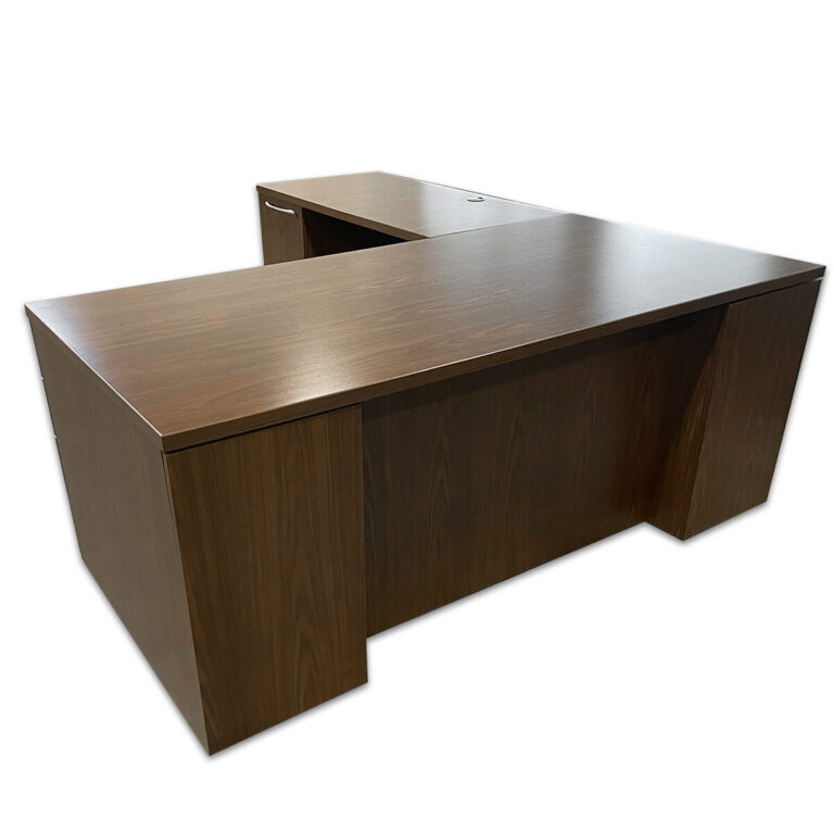Used 72" W Kimball L-shape Desk In Modern Walnut - Left Hand A professional L-shape desk built for function and organization, featuring a modern walnut laminate finish, left-hand return, and built-in grommets for clean cable management. Walnut laminate finish Left-hand return configuration Locking Box/Box/File & File/File pedestals Integrated grommets for wire management Commercial-grade construction Dimensions: Desk – 72″W x 36″D x 29½″H Return – 48″W x 24″D Perfect for private offices, executive workstations, and professional environments.