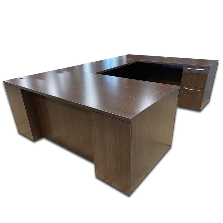 Used 72" W Kimball U-Shape Desk in Modern Walnut Finish – Right-Hand  This Kimball U-shape desk offers a spacious and efficient workstation layout, designed with a modern walnut finish and integrated storage. The configuration includes a desk, bridge, and credenza for maximum workspace and organization. Modern Walnut Laminate Finish Right-Hand U-Shape Configuration Integrated Storage Pedestals Grommet Holes for Cable Management Dimensions: Desk: 72"W x 36"D x 29.5"H Bridge: 48"W x 24"D x 29.5"H Credenza: 72"W x 24"D x 29.5"H Ideal for executive offices, private work areas, and commercial environments.