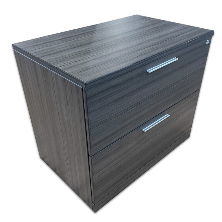 Used 34" W Two Drawer Lateral File In Grey Woodgrain A practical filing solution designed for organized document storage, featuring a clean, modern grey woodgrain laminate finish.  Grey woodgrain laminate finish Locking file drawers Dimensions: 34½″W x 22″D x 29½″H Perfect for offices, private workspaces, and filing areas.
