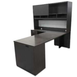 Used 84" W L-Shape Desk W/ Hutch In Grey Woodgrain – Left Hand A practical L-shape desk with overhead hutch, designed for maximum storage and workspace efficiency. Features a modern grey woodgrain laminate finish, locking drawers, and a tack board under the hutch for convenient organization. Grey woodgrain laminate finish Left-hand return configuration Box, box, file pedestal & File, File Pedestal - locking drawers Overhead hutch with sliding doors and open cubbies Integrated tack board and grommets for cable management Dimensions: Desk – 84″W x 30″D x 30″H Return – 36″W x 24″D x 30″H Perfect for executive offices, private workspaces, and home offices.