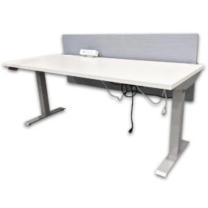 Used 70" W Haworth Sit-Stand Desk W/ Power and Privacy Panel - Grey / White Height-adjustable workstation designed to support both seated and standing work throughout the day. This setup includes a powered worksurface, integrated outlet unit, and privacy panel for a complete, ready-to-use station. Electric sit-stand height adjustment from 28.5" to 48" Programmable handset with memory presets for quick positioning 70" wide worksurface supports monitors, laptops, and accessories Integrated power unit with outlets and USB ports Modesty/privacy panel  Silver Frame Commercial grade construction suitable for daily use Dimensions: 70"W x 31"D x 28.5"–48"H Perfect for offices, private workstations, and adjustable work environments.