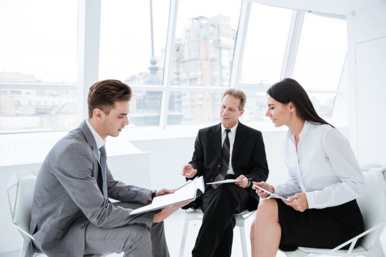 graphicstock three business people sit on chairs with documents in conference room B8tlrKv7 nl PMNW