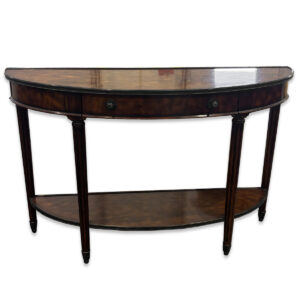 Used 54"W Dark Brown Traditional Half-Moon Console Table This elegant dark brown console table features a half-moon design with a lower shelf for added storage or display. Its smooth wood finish and decorative drawer accents make it both functional and refined. Dark brown wood finish Half-moon tabletop design Decorative drawers with metal pulls Lower shelf for additional storage or display Dimensions: 54Wx18Dx34H Perfect for entryways, reception areas, or executive offices.