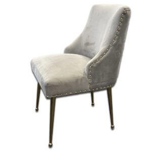 Used Gray & Gold Suede Side Chair This chair features soft gray suede upholstery accented with gold nailhead trim and sleek gold metal legs. The back handle adds a refined touch, combining functionality with comfort and style. Gray suede upholstery Gold nailhead trim Gold metal legs with rounded feet Back handle for easy movement Dimensions: 24"W x 26"D x 34"H Perfect for office seating, guest areas, or lounge spaces.